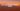 Majestic mountain range in Mexico, lush green valleys, volcanic peaks under a clear blue sky, vibrant sunset colors, realistic landscape.