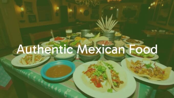 Colorful table spread of authentic Mexican food including tacos, mole, and fresh ingredients, vibrant and inviting, traditional setting, warm lighting, festive mood.